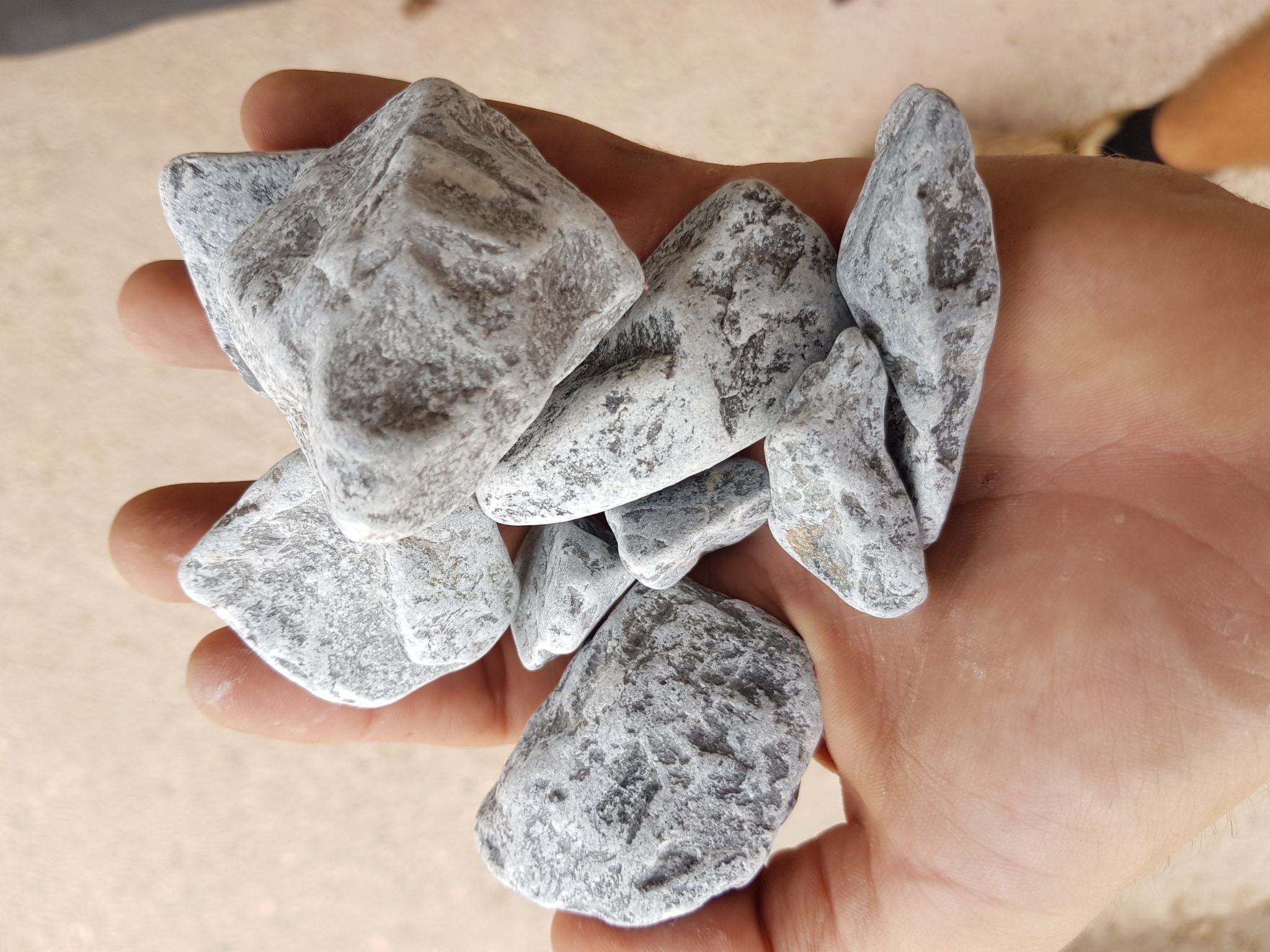 Grey Pebble in hand 20-40mm